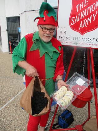 THE ELF RINGS SALVATION ARMY BELL AT  GOVERNMENT PLAZA