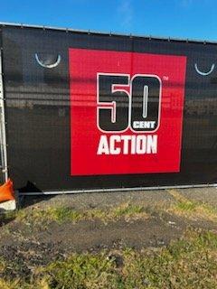 SHOULD “50 CENT” ADVERTISE HIS BOOZE ON DOWNTOWN FENCES