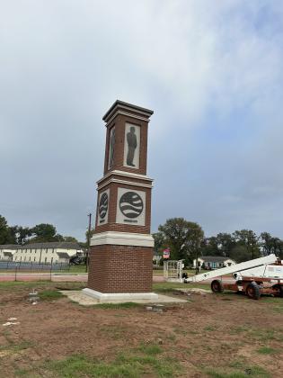 BIGBY MONUMENT ON EAST TEXAS ROUNDABOUT NOW HAS ADORNMENTS