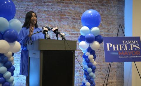 Tammy Phelps standing at podium at mayoral announcement.