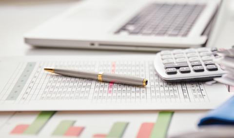 financial reports and calculator