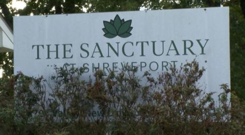 Sanctuary Apartments sign